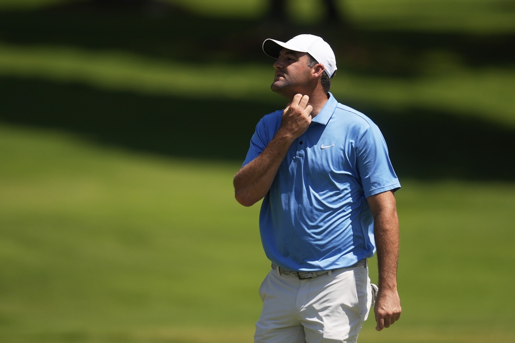 Scottie Scheffler walks off the first green during the third round of the St. Jude Championship golf tournament Saturday, Aug. 9, 2025, in Memphis, Tenn. (AP Photo/George Walker IV)