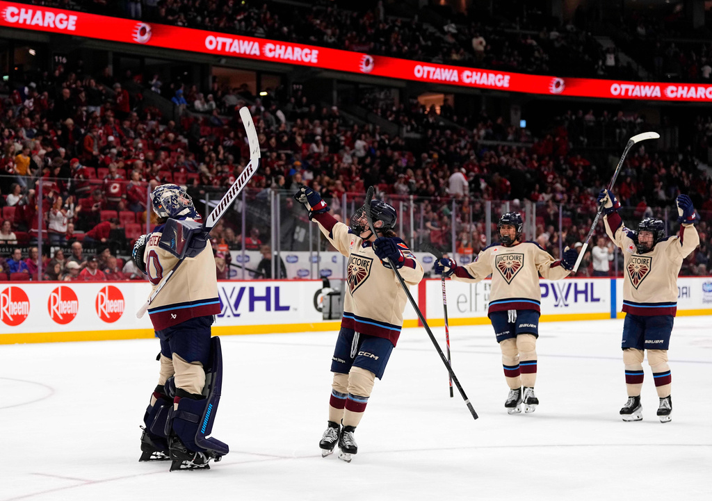Montreal Victoire goaltender Sandra Abstreiter, left, celebrates after her shutout against the Ottawa Charge in PWHL hockey game action in Ottawa, Ontario, Friday, April 3, 2026. (Justin Tang/The Canadian Press via AP)