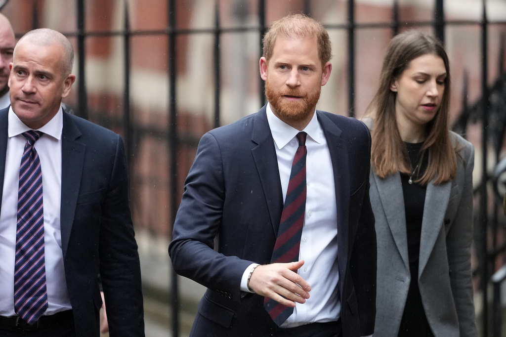 FILE - Britain's Prince Harry arrives at London's High Court to lead a group, including Elton John and Elizabeth Hurley, accusing the Daily Mail's publisher of privacy invasion through unlawful tactics in a trial that is part of a wider phone hacking scandal in London, Jan. 21, 2026. (AP Photo/Kirsty Wigglesworth, File)