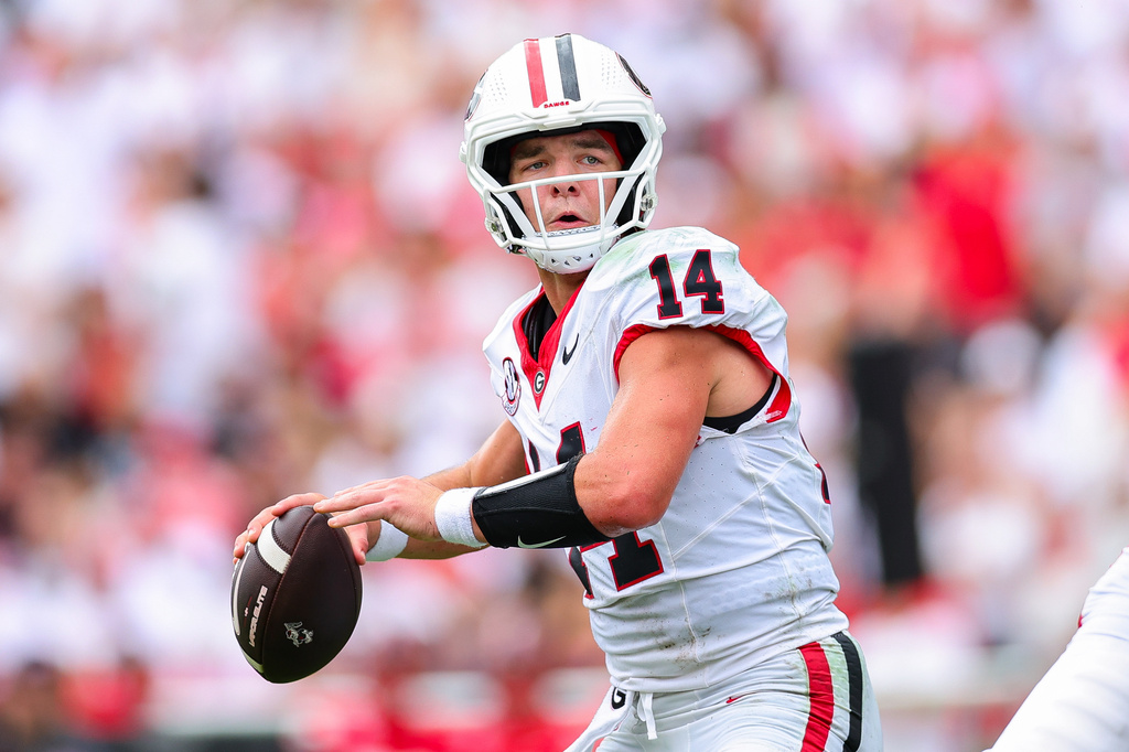 Georgia quarterback Gunner Stockton (14) looks to throw during the first half of an NCAA college football game against Western Kentucky, Saturday, Sept. 12, 2026, in Athens, Ga. (AP Photo/Colin Hubbard)