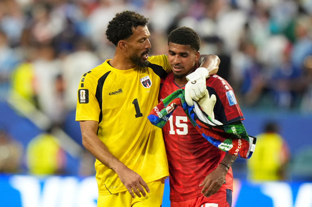 Cape Verde goalkeeper Vozinha, left, and Laros Duarte react at the end of the World Cup Group H soccer match between Uruguay and Cape Verde in Miami Gardens, Fla., Sunday, June 21, 2026. (AP Photo/Lynne Sladky)