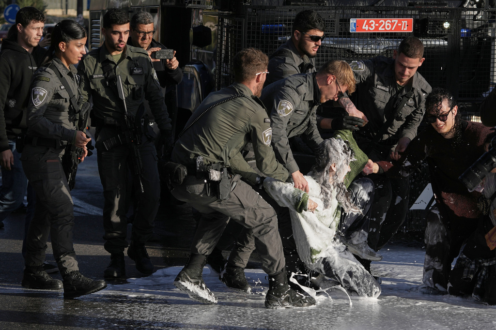 Police disperse demonstrators during a protest against the decision by Israel's parliament to approve the death penalty for Palestinians convicted of murdering Israelis, in Jerusalem Tuesday, March 31, 2026. (AP Photo/Mahmoud Illean)