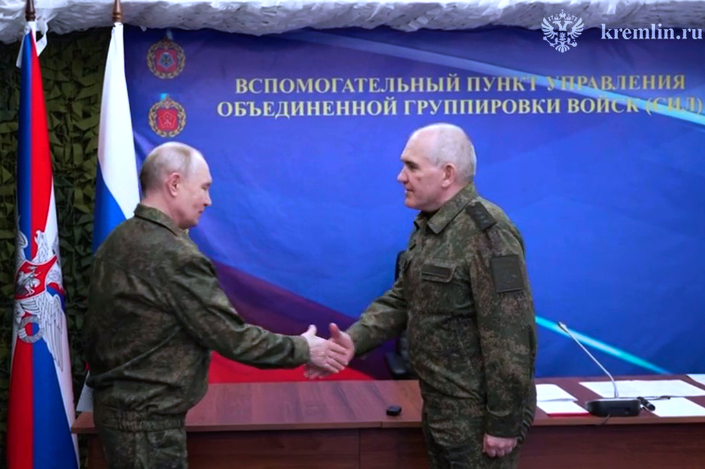 In this image from video provided by the Russian Presidential Press Service on Friday, July 3, 2026. Russian President Vladimir Putin, left, shakes hands with Deputy Chief of Russian Army General Staff Lt.-Gen. Sergei Rudskoy as he visits one of the command posts of the Joint Group of the Russian Forces, at an undisclosed location. (Russian Presidential Press Service via AP)