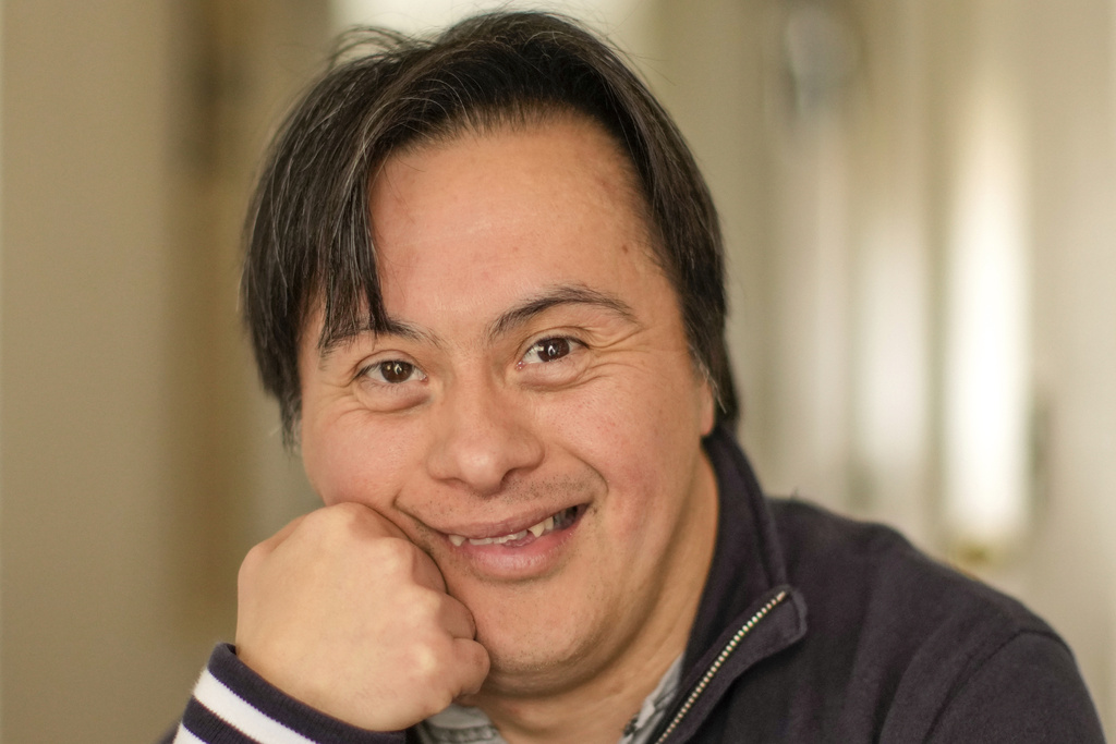 Actor Sebastián Solorza, who has Down syndrome and aims to run for president as an independent candidate, poses for a photo at his home in Santiago, Chile, Thursday, July 31, 2025. (AP Photo/Esteban Felix)
