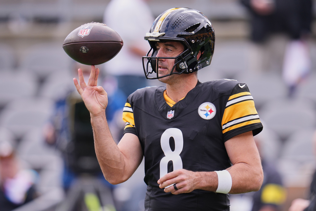 Pittsburgh Steelers quarterback Aaron Rodgers (8) warms up before an NFL football game against the Cleveland Browns in Pittsburgh, Sunday, Oct. 12, 2025. (AP Photo/Gene J. Puskar)