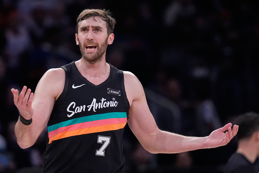 San Antonio Spurs' Luke Kornet reacts to a call during the first half of an NBA basketball game against the New York Knicks Sunday, March 1, 2026, in New York. (AP Photo/Seth Wenig)