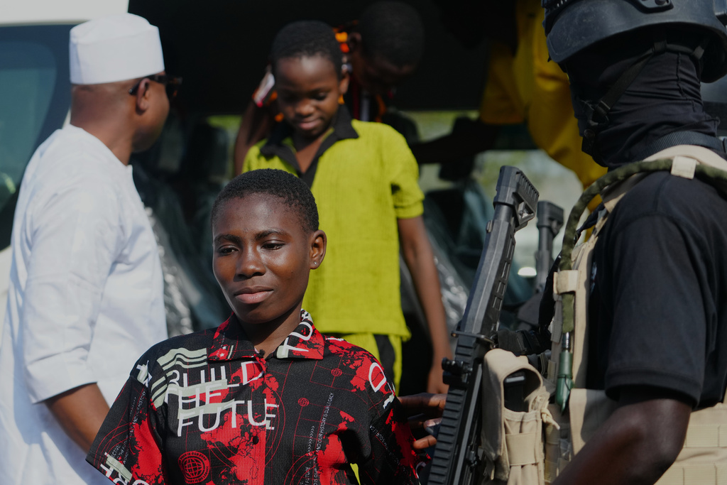 Freed students of St. Mary's Catholic School in the Papiri community, upon their arrival at the government house, in Minna, Nigeria, Monday, Dec. 22, 2025. (AP Photo/Sunday Alamba)