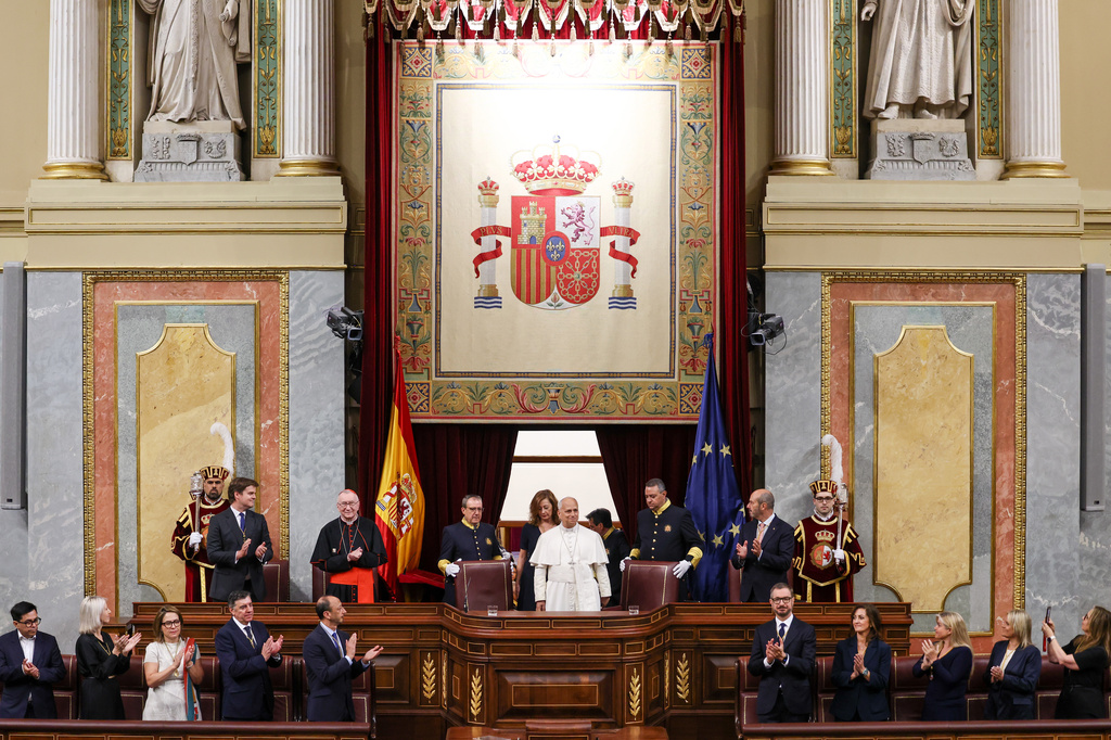 Pope Leo XIV is flanked by Francina Armengol, President of the Congress of Deputies of Spain, as he arrives to meet with members of the Spanish Parliament at the Congress of Deputies, in Madrid, Monday, June 8, 2026. (Yara Nardi, Pool Photo via AP)