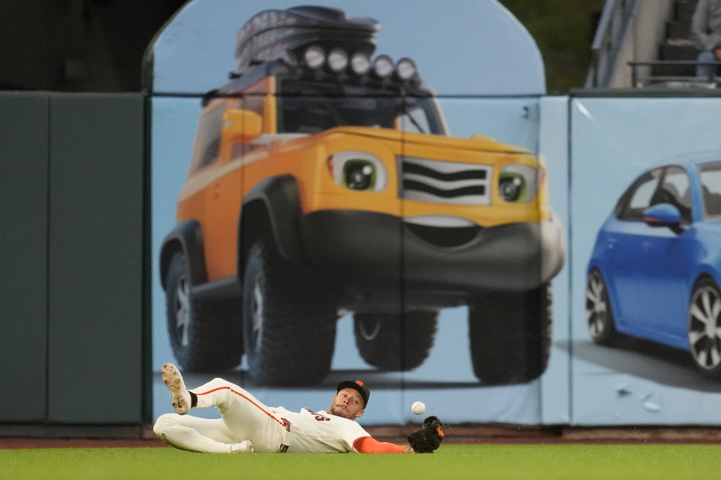 San Francisco Giants left fielder Grant McCray cannot catch an RBI double hit by Arizona Diamondbacks' Lars Nootbaar during the third inning of the second baseball game of a doubleheader, Saturday, Aug. 29, 2026, in San Francisco. (AP Photo/Jeff Chiu)