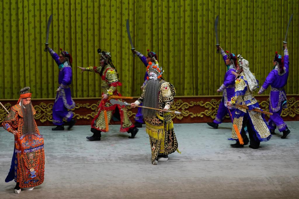Peking Opera actors perform during a show at Jixiang Theatre in Beijing, China, Sunday, Sept. 7, 2025. (AP Photo/Mahesh Kumar A.)