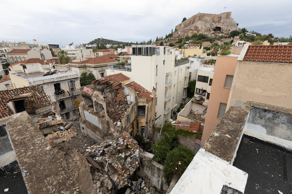 A general view of the area where a powerful blast caused a building to collapse and injured a few people in Athens' Plaka district, Saturday, Sept. 26, 2026. (AP Photo/Yorgos Karahalis)