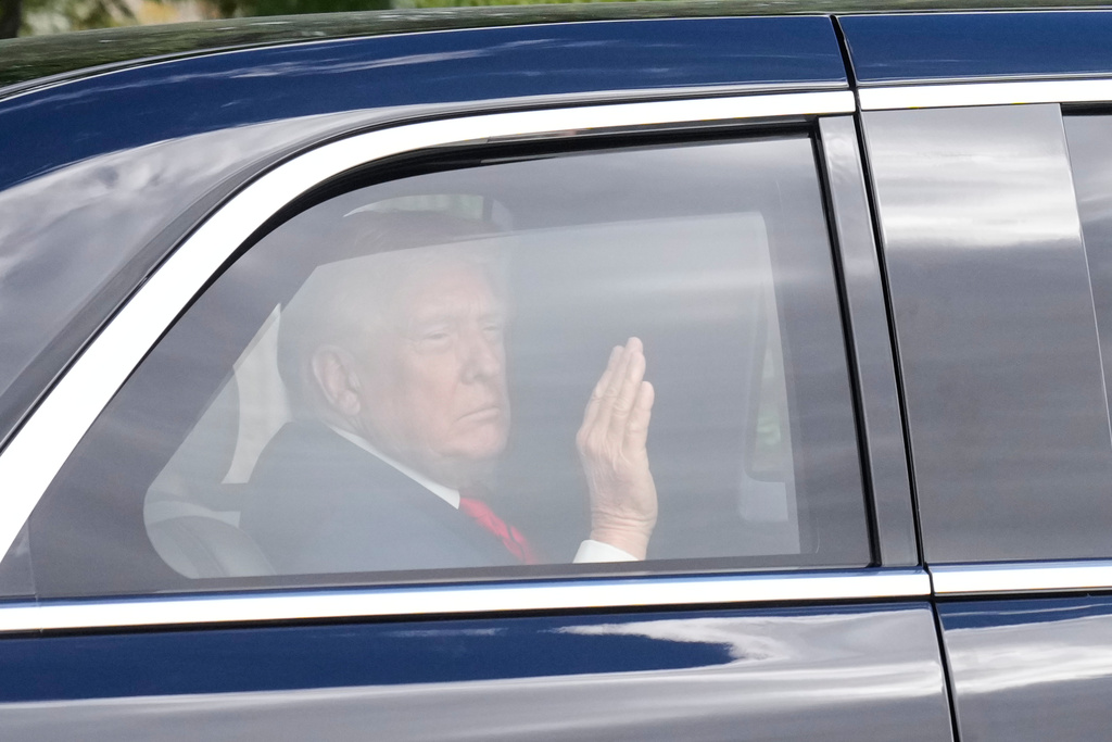 President Donald Trump departs Walter Reed National Military Medical Center in Bethesda, Md., Friday, Oct. 10, 2025. (AP Photo/Mark Schiefelbein)