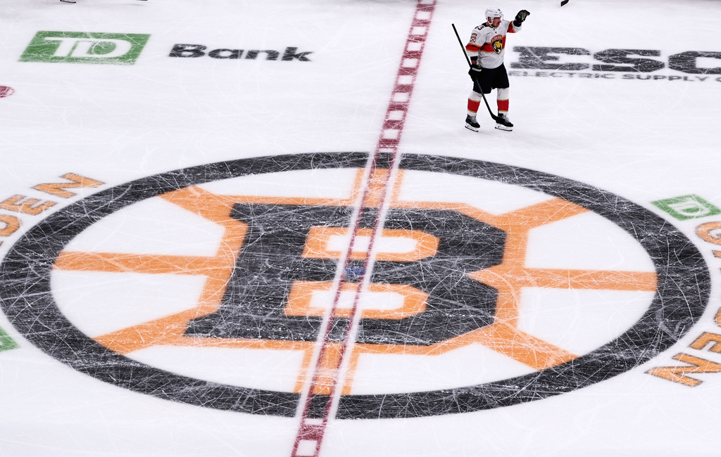 Florida Panthers left wing Brad Marchand (63), who played for more than 15 seasons with the Boston Bruins, acknowledges fans during a standing ovation during a break in the first period of an NHL hockey game, Tuesday, Oct. 21, 2025, in Boston. (AP Photo/Charles Krupa)