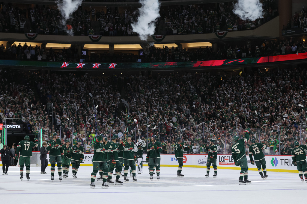 Minnesota Wild players celebrate after wining Game 6 in the first round of the NHL hockey Stanley Cup playoff series against the Dallas Stars, Thursday, April 30, 2026, in St. Paul, Minn. (AP Photo/Bailey Hillesheim)