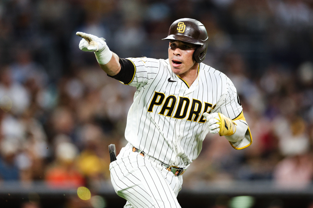 San Diego Padres' Freddy Fermin gestures towards the dugout after hitting a single against the Pittsburgh Pirates in the third inning of a baseball game Monday, Aug. 24, 2026, in San Diego. (AP Photo/Derrick Tuskan)