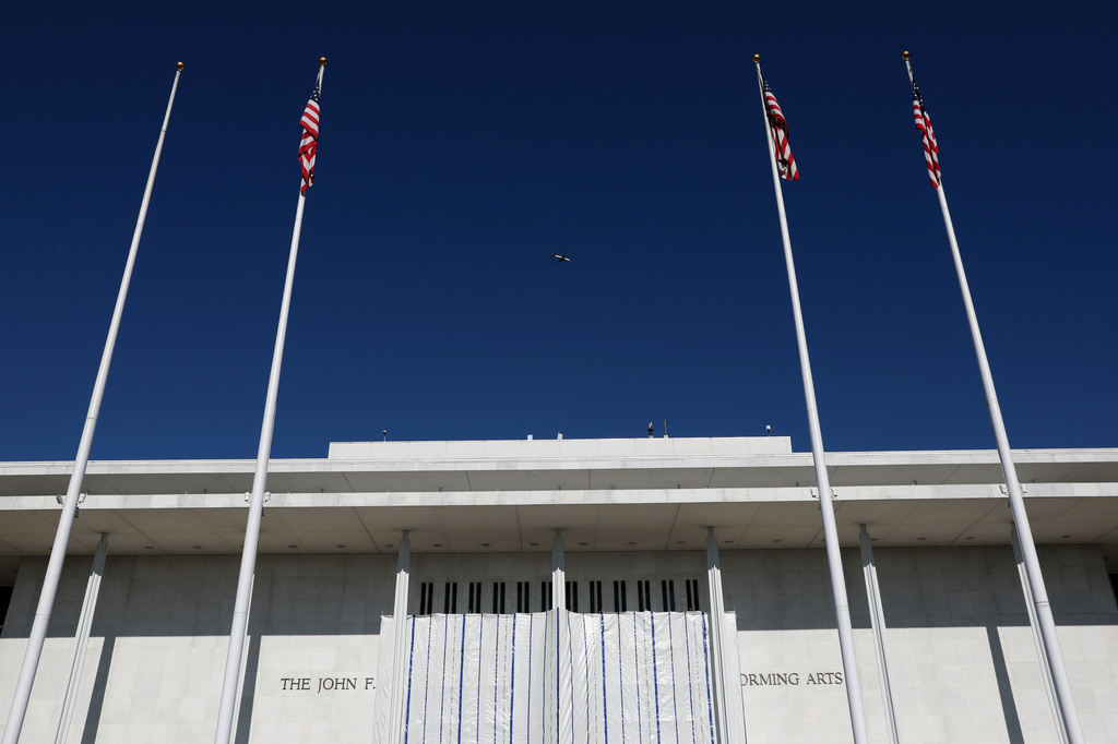 The wall of the John F. Kennedy Center for the Performing Arts is covered in tarp as work continues on the removal of President Donald Trump's name, Saturday, June 13, 2026 in Washington. (AP Photo/Rahmat Gul)