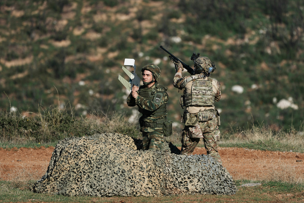 Greek military personnel take part in a live-fire exercise near the northeastern city of Alexandroupolis, Greece, testing domestically-developed drones and counter-drone systems as part of NATO's modernization efforts on Friday, Nov. 14, 2025. (AP Photo/Thanassis Stavrakis)