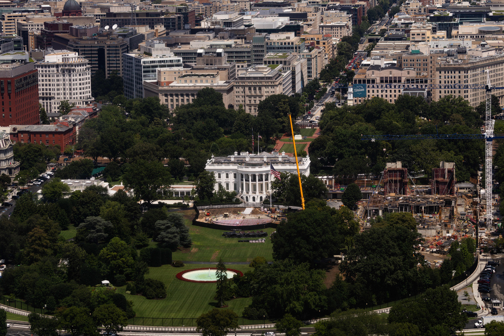 Construction continues on a helipad and the White House Ballroom on the South Lawn of the White House, Wednesday, Aug. 5, 2026, in Washington. (AP Photo/Tierney L. Cross)