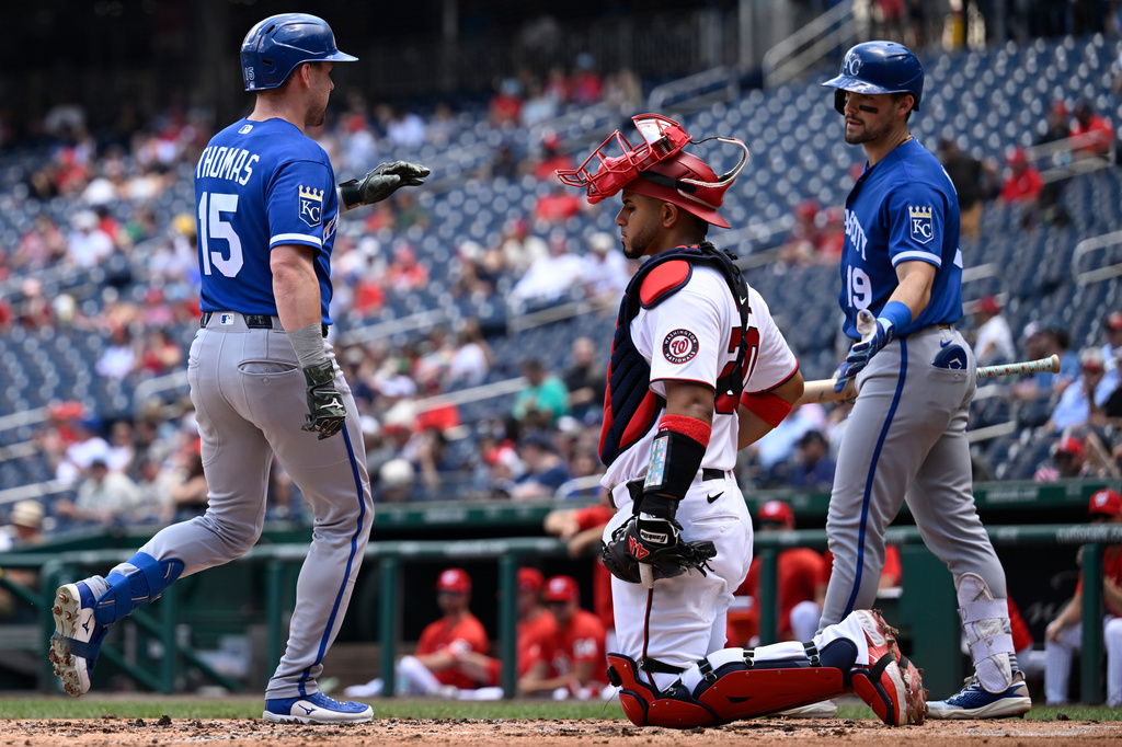 Washington Nationals catcher Keibert Ruiz waits for the next batter as Kansas City Royals' Lane Thomas (15) is greeted at the plate by Royals' Michael Massey at home plate after hitting a solo home run during the third inning of a baseball game, Wednesday, June 17, 2026, in Washington. (AP Photo/John McDonnell)