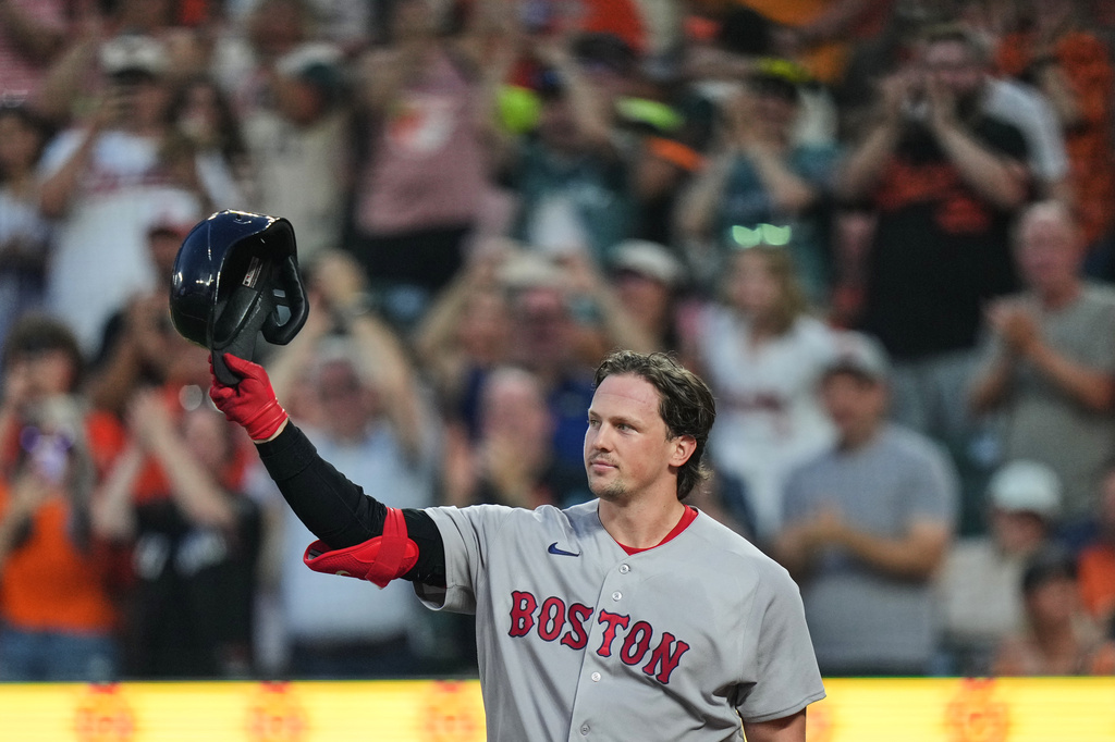 Boston Red Sox catcher Adley Rutschman acknowledges the crowd as he is honored during the first inning of a baseball game against the Baltimore Orioles, Thursday, Sept. 3, 2026, in Baltimore. (AP Photo/Stephanie Scarbrough)