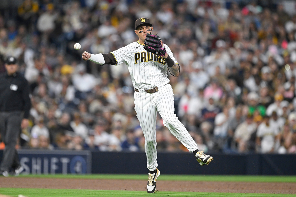 San Diego Padres third baseman Manny Machado throws out Detroit Tigers' Gleyber Torres during the sixth inning of a baseball game Saturday, March 28, 2026, in San Diego. (AP Photo/Denis Poroy)