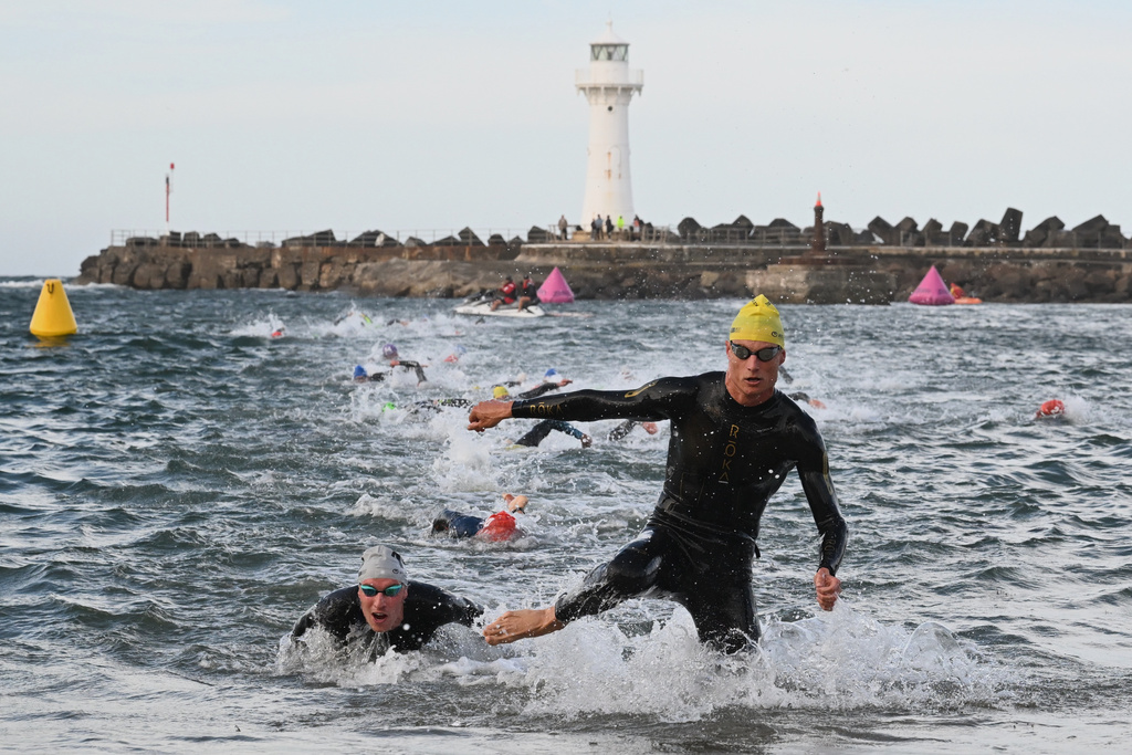 Matthew Hauser of Australia completes the swim leg during the Elite Men's final at the World Triathlon Championships in Wollongong, Australia, Sunday, Oct. 19, 2025. (Dean Lewins/AAPImage via AP)