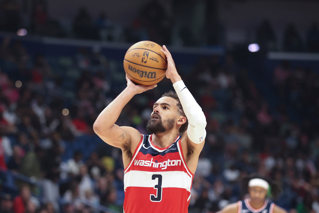 FILE - Washington Wizards guard Trae Young attempts a technical foul free throw against the New Orleans Pelicans in the second half of an NBA basketball game in New Orleans, March 8, 2026. (AP Photo/Peter Forest, File)