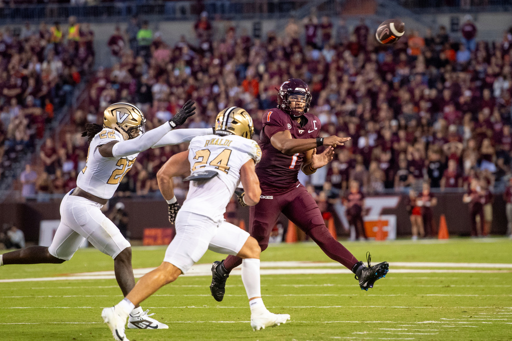 Virginia Tech quarterback Kyron Drones (1) throws downfield against Vanderbilt during the first half of an NCAA college football game Saturday, Sept. 6, 2025, in Blacksburg, Va. (AP Photo/Robert Simmons)