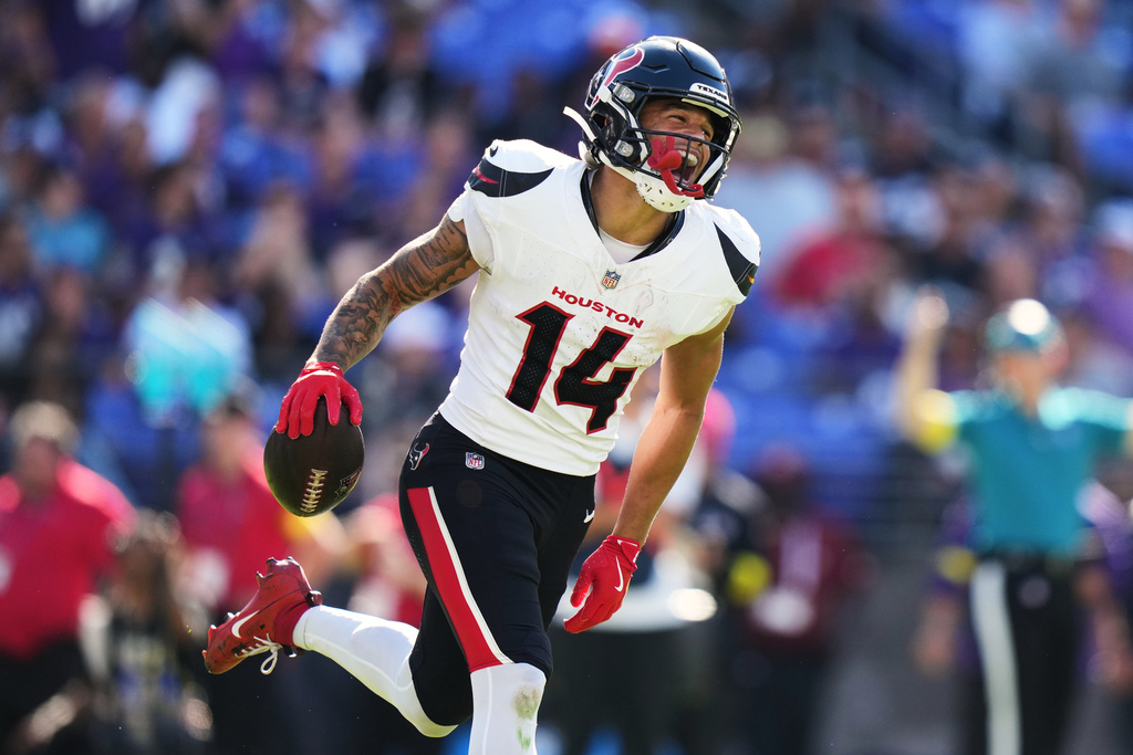 Houston Texans wide receiver Jaylin Noel (14) celebrates after scoring a touchdown during the second half of an NFL football game against the Baltimore Ravens, Sunday, Oct. 5, 2025, in Baltimore. (AP Photo/Stephanie Scarbrough)