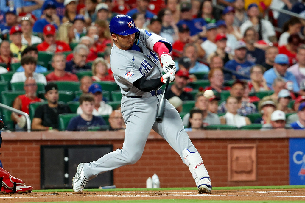 Chicago Cubs' Seiya Suzuki hits a double during the first inning of a baseball game against the St. Louis Cardinals, Monday, July 27, 2026, in St. Louis. (AP Photo/Scott Kane)
