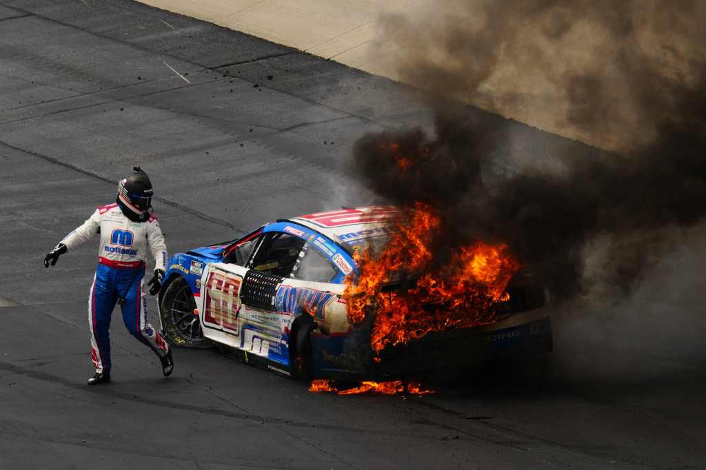 Ryan Preece escapes his burning car during the NASCAR All-Star auto race at Dover Motor Speedway, Sunday, May 17, 2026, in Dover, Del. (AP Photo/Derik Hamilton)
