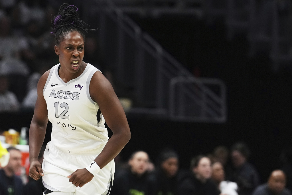 Las Vegas Aces guard Chelsea Gray reacts after a basket against the Seattle Storm during the first half of Game 2 in the first round of the WNBA basketball playoffs Tuesday, Sept. 16, 2025, in Seattle. (AP Photo/Lindsey Wasson)