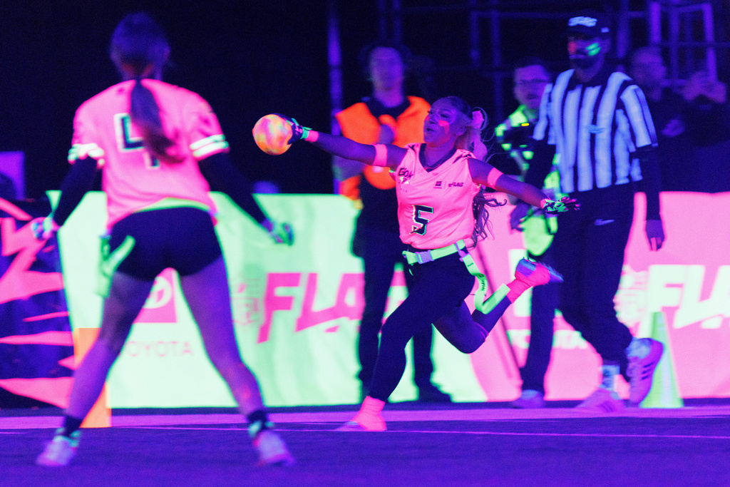 Team Pink's Gigi Torres (5) of Manteca High School, scores a touchdown against Team Green during the Toyota Glow-Up Classic flag football game in San Francisco on Wednesday, Feb. 4, 2026. (Santiago Mejia/San Francisco Chronicle via AP)