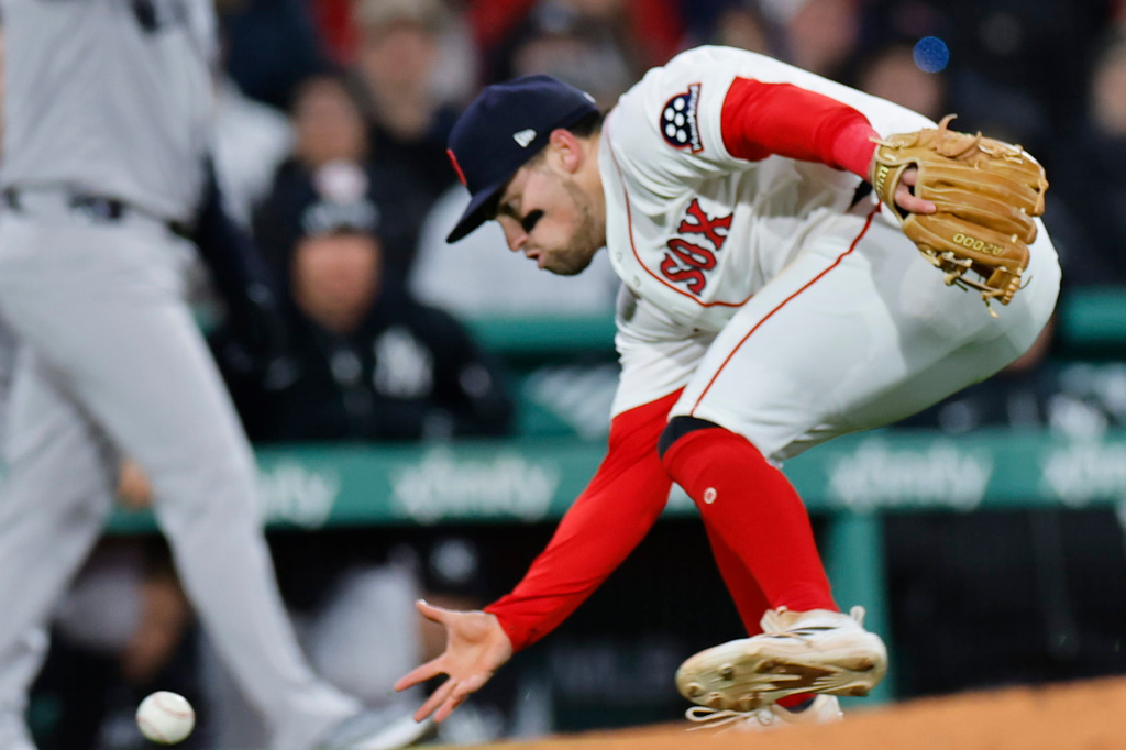 Boston Red Sox third baseman Caleb Durbin fields the ball during the sixth inning of a baseball game against the New York Yankees on Tuesday, April 21, 2026, in Boston. (AP Photo/CJ Gunther)