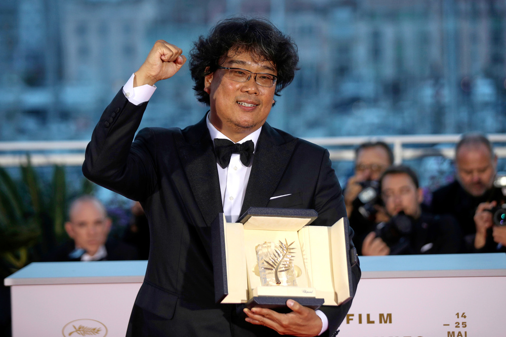 FILE - Director Bong Joon Ho poses with the Palme d'Or award for the film "Parasite" at the 72nd international film festival, Cannes, southern France on May 25, 2019. (AP Photo/Petros Giannakouris, File)