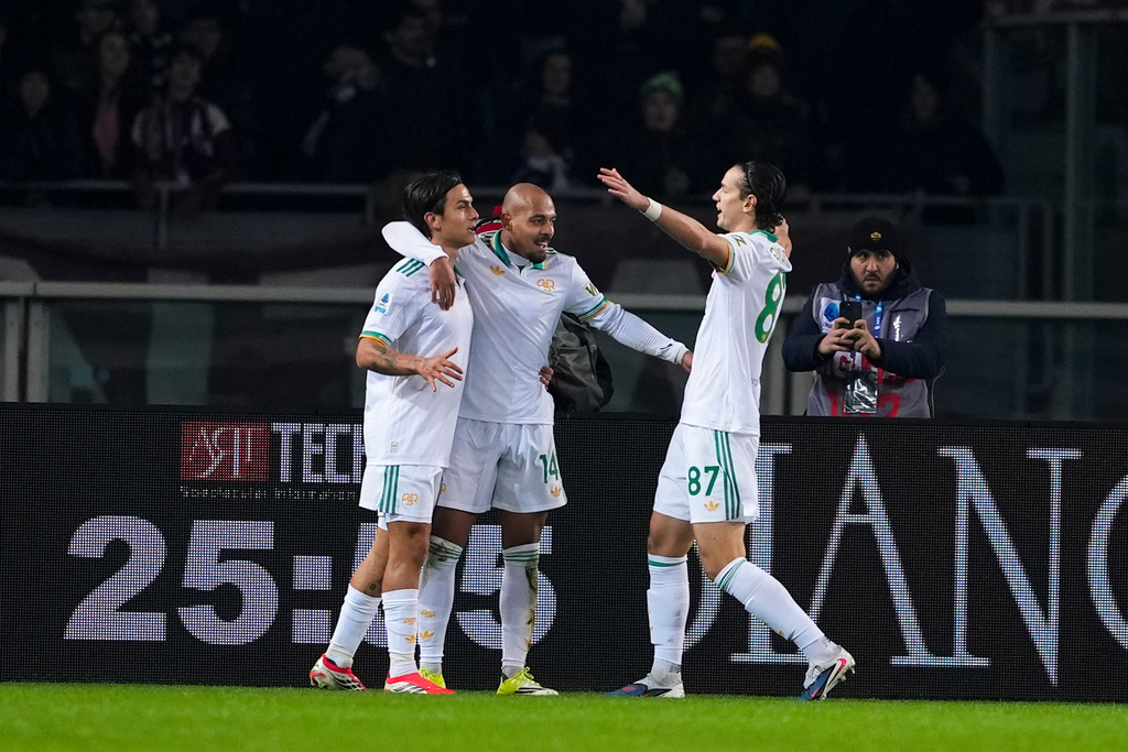 Roma's Donyell Malen, centre, celebrates after scoring the opening goal during the Serie A soccer match between Torino and Roma in Turin, Italy, Jan. 18, 2026. (Fabio Ferrari/LaPresse via AP)