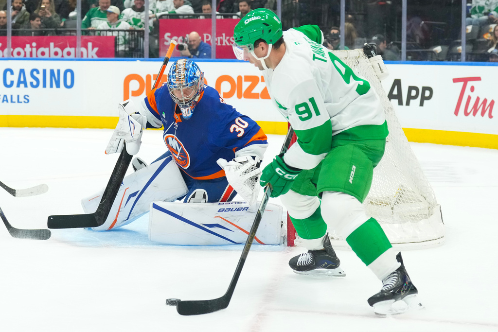 Toronto Maple Leafs' John Tavares (91) shoots on New York Islanders goaltender Ilya Sorokin (30) during second period NHL hockey action in Toronto, on Tuesday March 17, 2026. (Chris Young/The Canadian Press via AP)