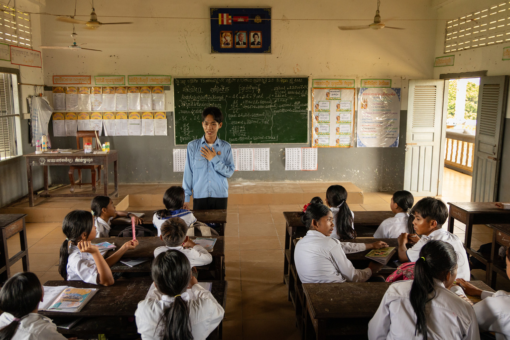 A teacher addresses students at a school in one of the floating villages of Cambodia's Tonle Sap Lake on Monday, June 29, 2026. (AP Photo/Anton L. Delgado)