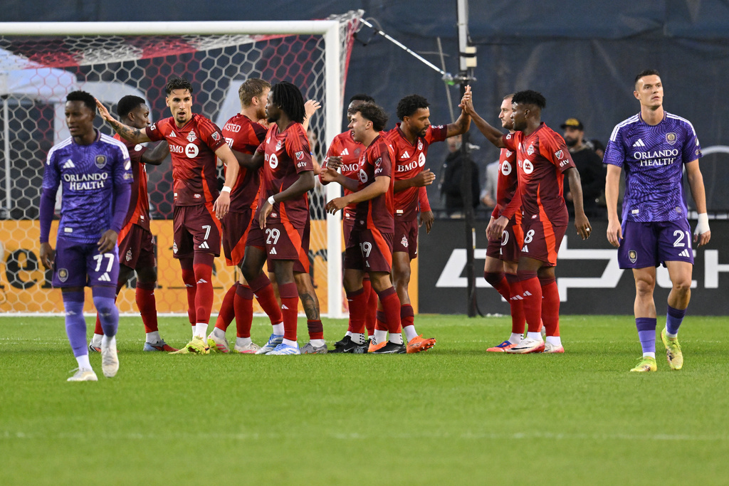 Toronto FC players celebrate after a goal against Orlando City during the first half of an MLS soccer match in Toronto, Saturday, Oct. 18, 2025. (Jon Blacker/The Canadian Press via AP)