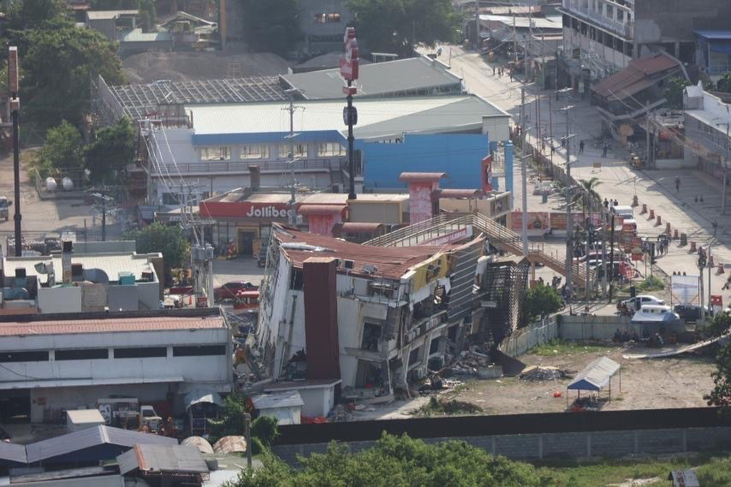 In this photo provided by the Philippine Coast Guard, damaged structures are seen a day after a strong earthquake struck in General Santos city, southern Philippines on Tuesday, June 9, 2026. (Philippine Coast Guard via AP)
