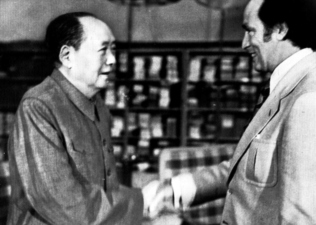 FILE - Canada's Prime Minister Pierre E. Trudeau, right, shakes hands with Mao Tse-tung, party chief of the People's Republic of China Oct. 13, 1973. (AP Photo, File)