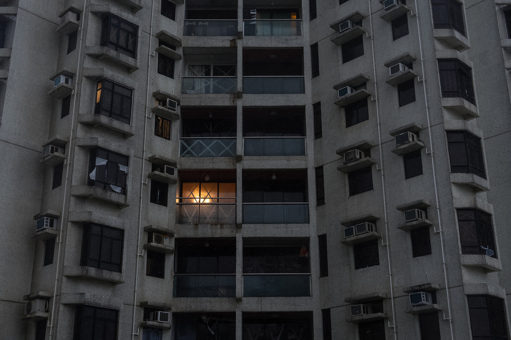 Taped-windows are seen under strong wind in Heng Fa Chuen area as Super Typhoon Ragasa approaches in Hong Kong, Wednesday, Sept. 24, 2025. (AP Photo/Chan Long Hei)