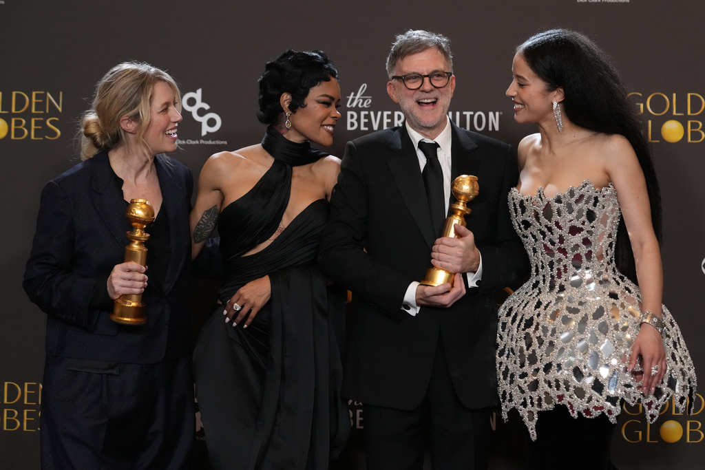 Sara Murphy, from left, Teyana Taylor, Paul Thomas Anderson, and Chase Infiniti pose in the press room with the award for best motion picture – musical or comedy for "One Battle After Another" during the 83rd Golden Globes on Sunday, Jan. 11, 2026, at the Beverly Hilton in Beverly Hills, Calif. (AP Photo/Chris Pizzello)