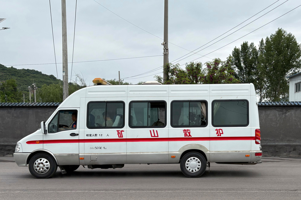 An emergency vehicle is seen leaving from the Liushenyu coal mine facility in Qinyuan county in Changzhi, northern China's Shanxi province on Sunday, May 24, 2026. (AP Photo/E. Eduardo Castillo)