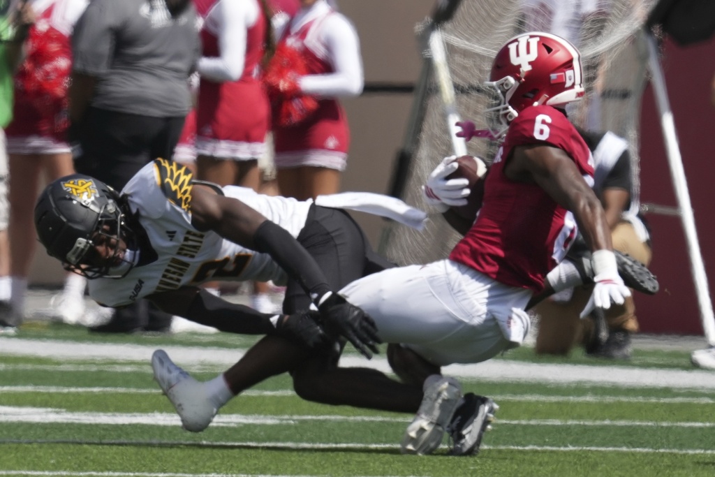 Indiana wide receiver LeBron Bond (6) is tackled by Kennesaw State defensive back Caleb Offord (2) during the first half of an NCAA college football game, Saturday, Sept. 6, 2025, in Bloomington, Ind. (AP Photo/Darron Cummings)