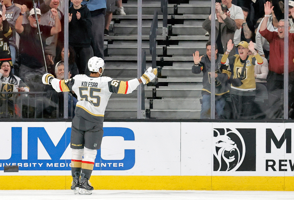 Vegas Golden Knights right wing Keegan Kolesar (55) faces fans after scoring against the Chicago Blackhawks during the first period of an NHL hockey game Saturday, March 14, 2026, in Las Vegas. (AP Photo/Steve Marcus)