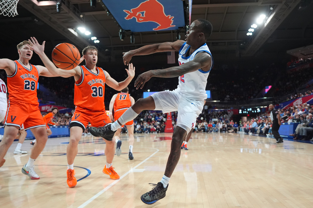 SMU guard Boopie Miller (2) passes against Virginia guard Dallin Hall (30) and forward Thijs de Ridder (28) during the first half of an NCAA college basketball game Saturday, Jan. 17, 2026, in Dallas. (AP Photo/LM Otero)