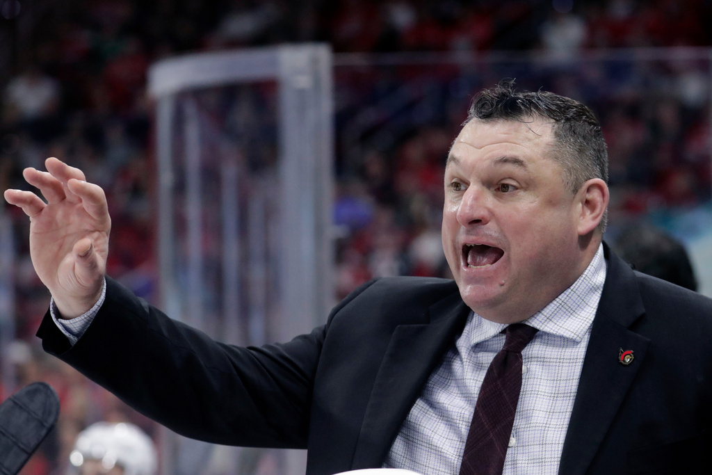 FILE - Ottawa Senators head coach D.J. Smith directs the team during the first period of an NHL hockey game against the Carolina Hurricanes, April 4, 2023, in Raleigh, N.C. (AP Photo/Chris Seward, File)