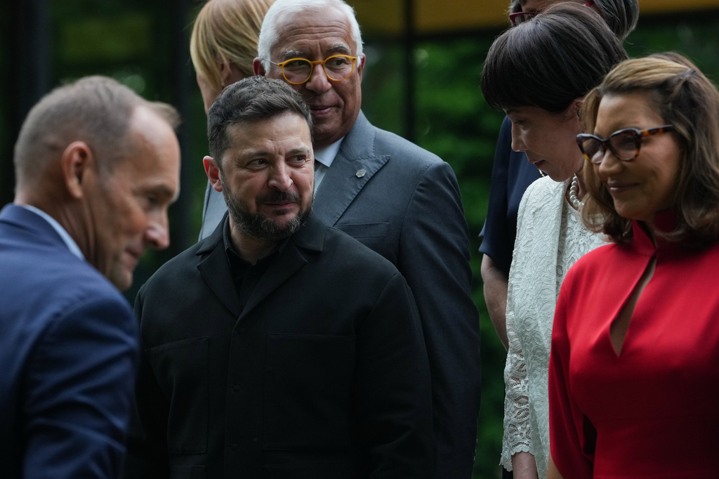 European Council President Antonio Costa, Ukrainian President Volodymyr Zelenskyy, Japan's Prime Minister Sanae Takaichi and others gather for a group photo at the G7 summit, Tuesday, June 16, 2026, in Evian-les-Bains, France. (AP Photo/Julia Demaree Nikhinson)