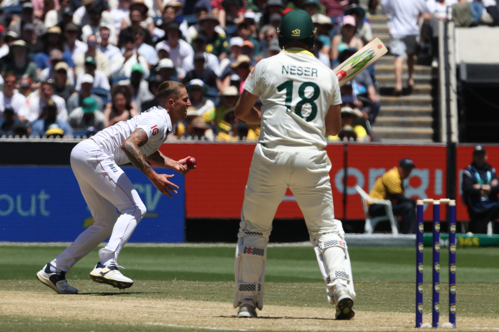 England's Brydon Carse, left, grabs the ball for a caught and bowled on Australia's Michael Neser, right, on Day 2 of their Ashes cricket test match in Melbourne, Saturday, Dec. 27, 2025. (AP Photo/Hamish Blair)
